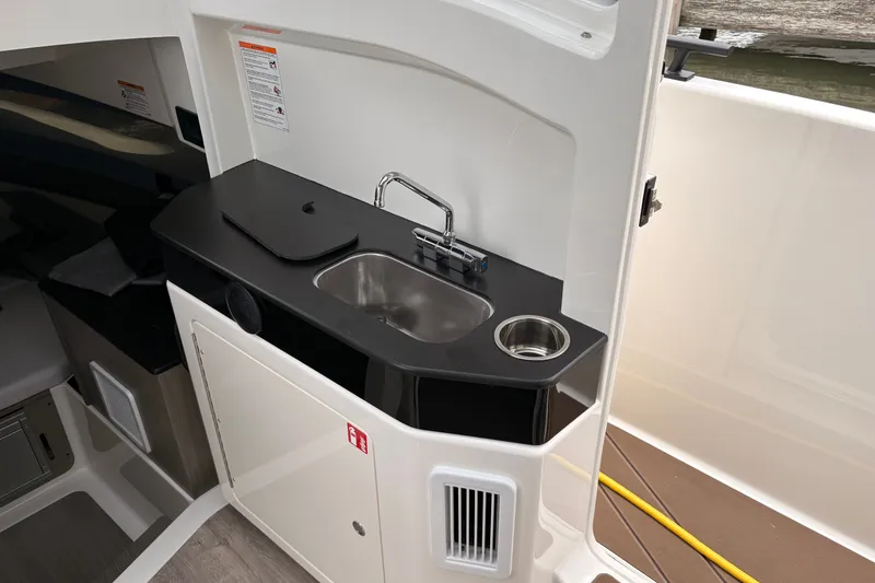Slide: The Image of Compact kitchenette in 2026 Navan C30 boat with sink and storage. - 18