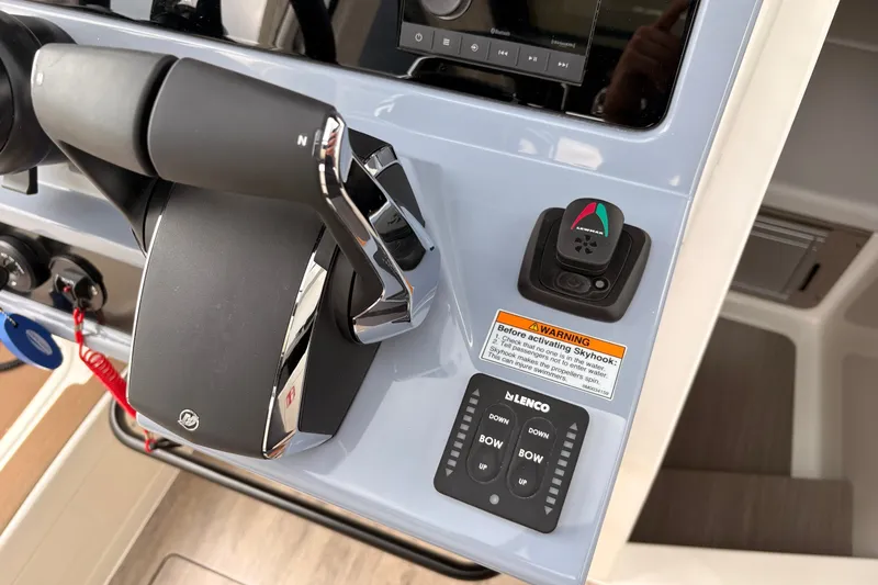 Slide: The Image of Control panel of a 2026 Navan C30 boat with throttle and navigation controls. - 22