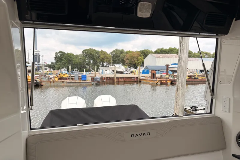 Slide: The Image of View from Navan C30 boat cabin, overlooking marina with boats and warehouses, 2026 model. - 16