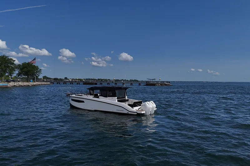 Slide: The Image of Navan C30 2026 boat cruising on a sunny day in open water. - 2