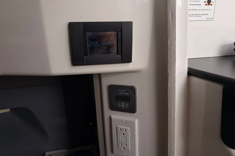 Slide: The Image of Control panel and outlets inside a 2026 Navan C30 vehicle interior. - 19