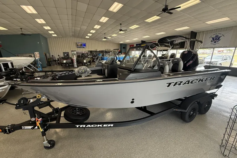 Slide: The Image of 2027 Tracker Targa V-19 Combo boat displayed in showroom on trailer. - 3