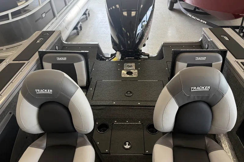 Slide: The Image of 2027 Tracker Targa V-19 Combo boat interior with branded seats and motor. - 5