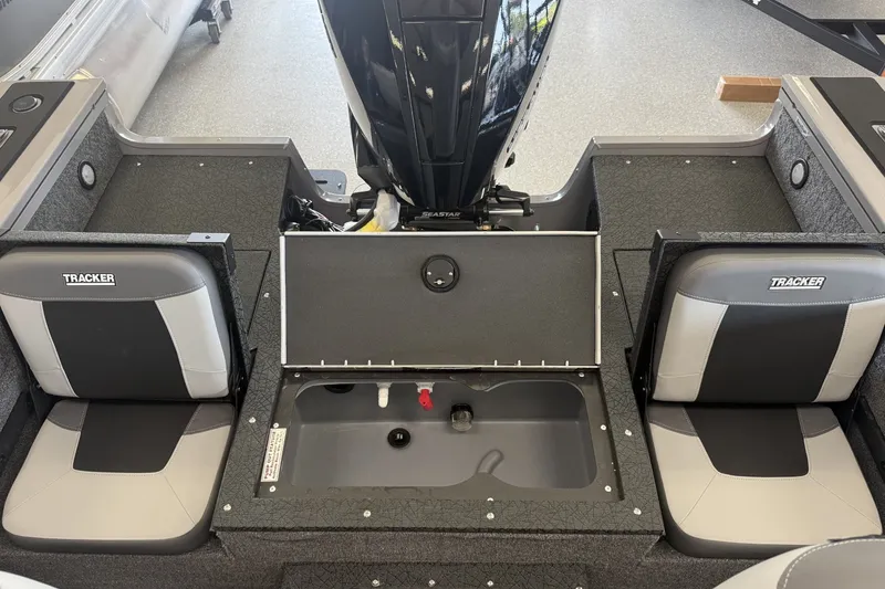 Slide: The Image of 2027 Tracker Targa V-19 Combo boat interior with dual seats and storage compartment. - 6