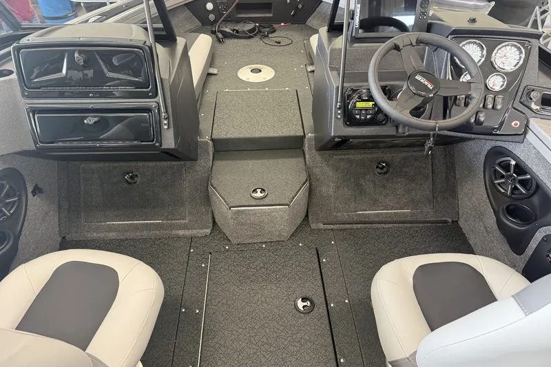 Slide: The Image of Interior of 2027 Tracker Targa V-19 Combo boat with steering wheel and seating. - 7