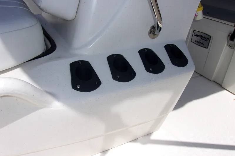 Slide: The Image of Rod holders on a 2019 Mako Pro Skiff 17 CC boat console. - 10