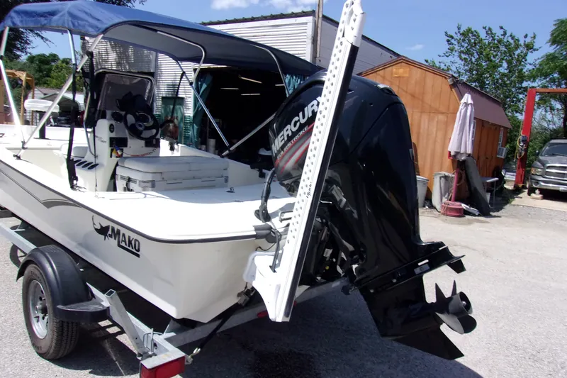 Slide: The Image of 2019 Mako Pro Skiff 17 CC boat with Mercury engine on trailer. - 4