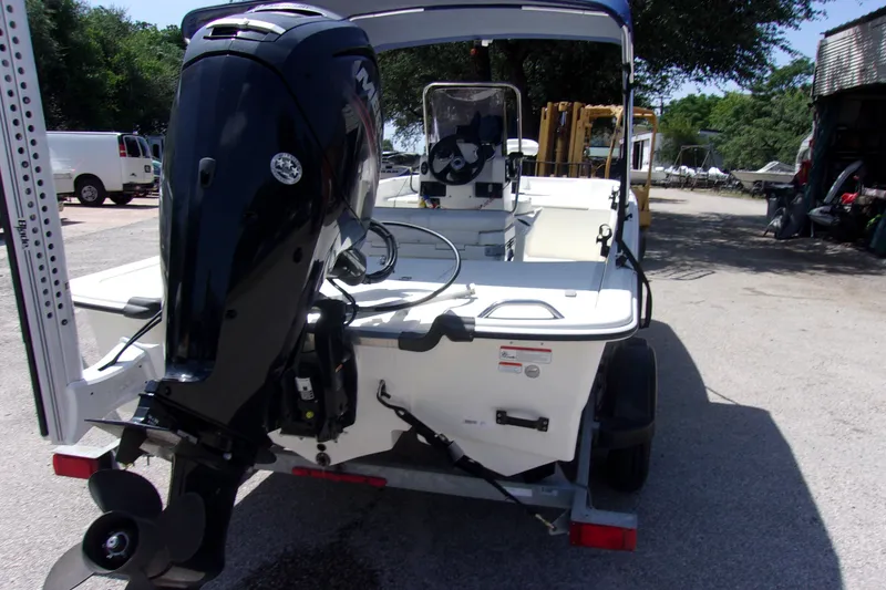 Slide: The Image of 2019 Mako Pro Skiff 17 CC boat with outboard motor on trailer. - 3