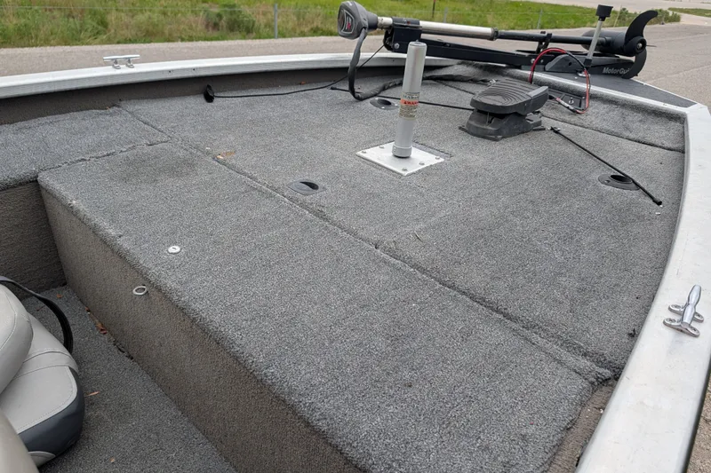 Slide: The Image of 1999 Tracker Pro Team 175 boat deck with carpet and trolling motor. - 16
