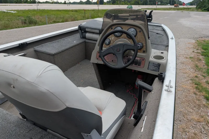 Slide: The Image of 1999 Tracker Pro Team 175 boat interior with steering wheel and seating. - 15