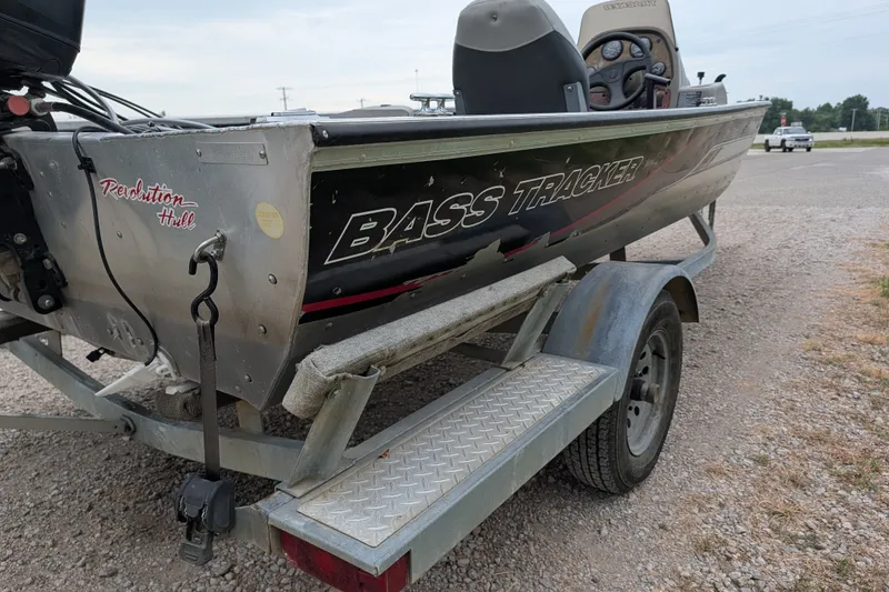 Slide: The Image of 1999 Tracker Pro Team 175 boat on trailer, featuring "Bass Tracker" branding. - 6