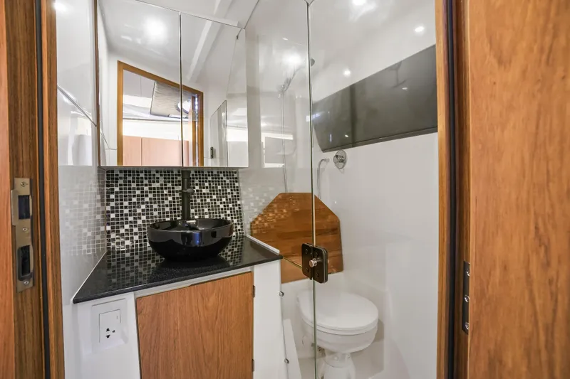 Slide: The Image of Modern bathroom in 2026 Hanover 355 RV with sleek design and glass shower. - 7