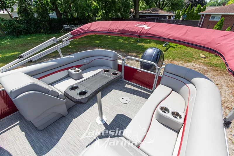 Slide: The Image of 2021 Bennington SV 22 Quad Bench pontoon boat with red canopy and spacious seating. - 24