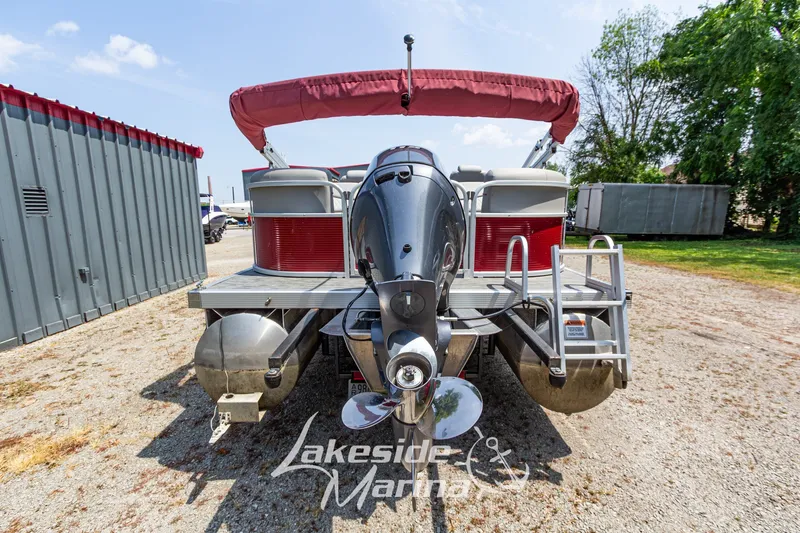 Slide: The Image of 2021 Bennington SV 22 Quad Bench pontoon boat with outboard motor, parked at Lakeside Marina. - 5