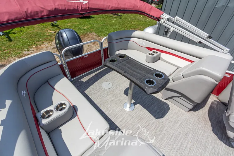 Slide: The Image of 2021 Bennington SV 22 Quad Bench pontoon boat interior with seating and cup holders. - 23