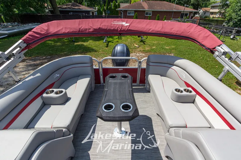 Slide: The Image of 2021 Bennington SV 22 Quad Bench pontoon boat with red canopy and spacious seating. - 22