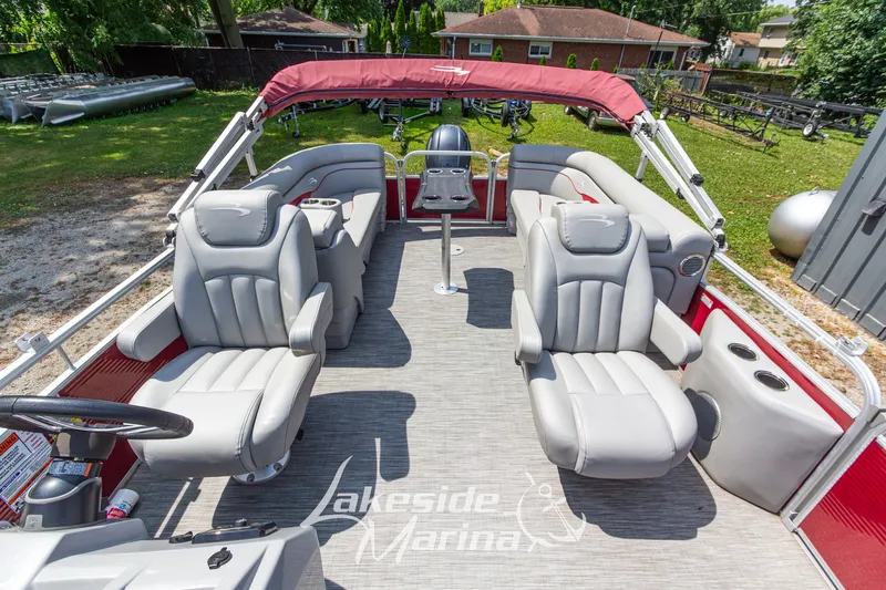 Slide: The Image of 2021 Bennington SV 22 Quad Bench pontoon boat with plush seating and red canopy. - 16