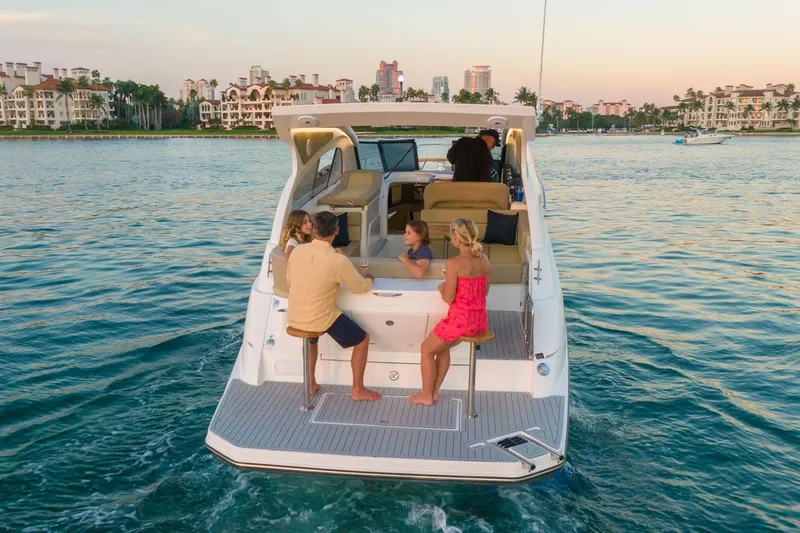 Slide: The Image of Luxury Hanover 375 yacht cruising with passengers, scenic waterfront view, 2026 model. - 7