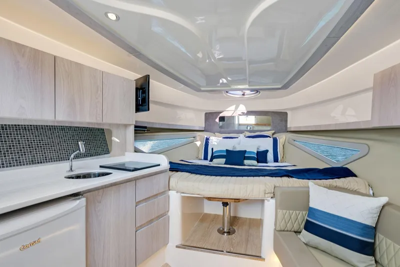 Slide: The Image of Luxurious interior of 2026 Hanover 375 yacht with modern kitchen and cozy bed. - 17