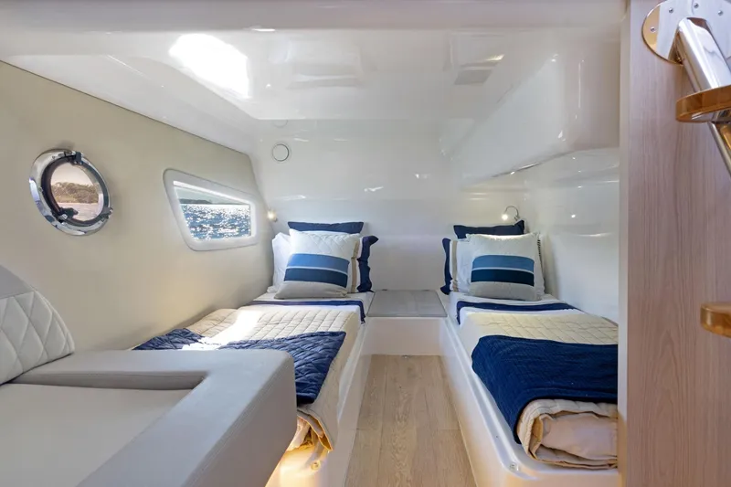 Slide: The Image of Luxurious cabin interior of 2026 Hanover 375 yacht with twin beds and nautical decor. - 16