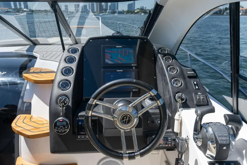Slide: The Image of Helm of 2026 Hanover 375 yacht with modern controls and navigation system. - 28