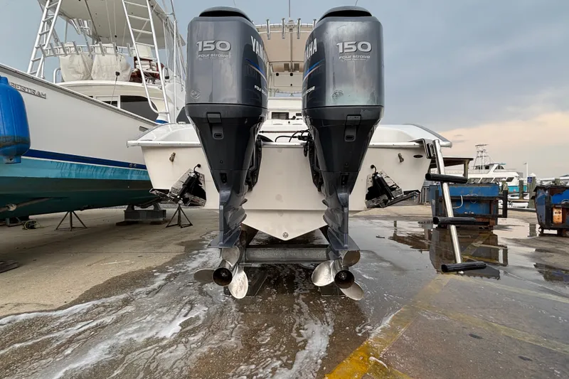 Slide: The Image of 2006 Cape Horn 24 boat with dual Yamaha 150 engines at a marina. - 4