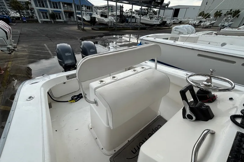 Slide: The Image of 2006 Cape Horn 24 boat interior with dual Yamaha 150 engines at a marina. - 27