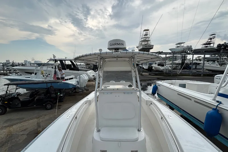 Slide: The Image of 2006 Cape Horn 24 boat docked at marina with Garmin equipment, surrounded by other vessels. - 21