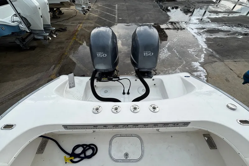 Slide: The Image of 2006 Cape Horn 24 boat with dual Yamaha 150 engines at a marina. - 11