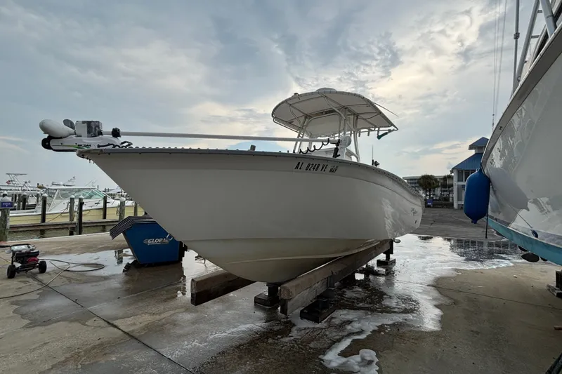 Slide: The Image of 2006 Cape Horn 24 boat on a dock, cloudy sky background. - 6