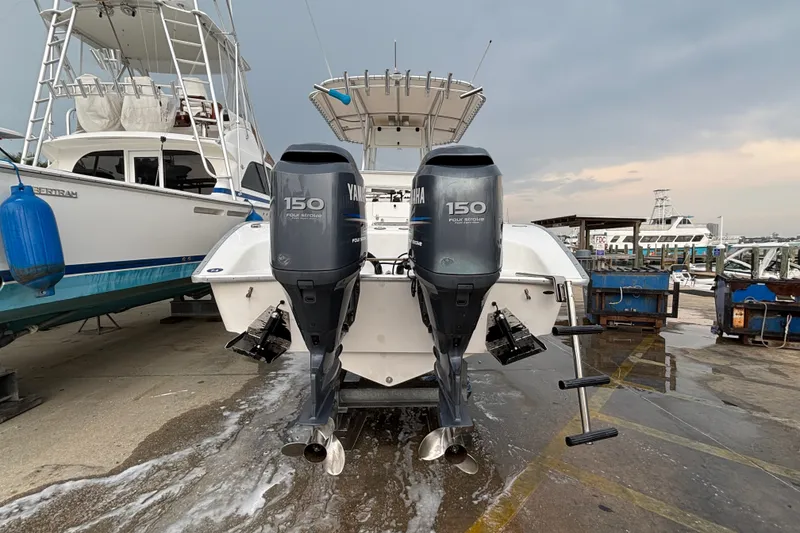 Slide: The Image of 2006 Cape Horn 24 boat with twin Yamaha 150 engines at a marina. - 3