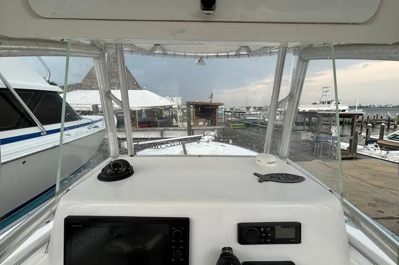 Slide: The Image of 2006 Cape Horn 24 boat dashboard view at marina with overcast sky. - 16
