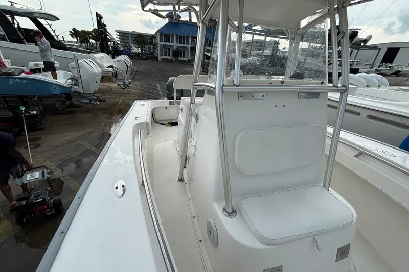 Slide: The Image of 2006 Cape Horn 24 boat on dock, featuring center console and clean white deck. - 23