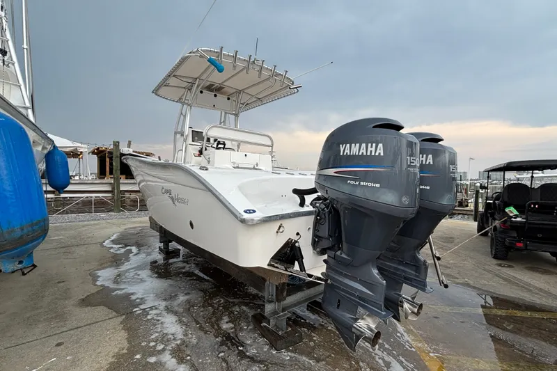 Slide: The Image of 2006 Cape Horn 24 boat with twin Yamaha 150HP engines on a dock. - 5
