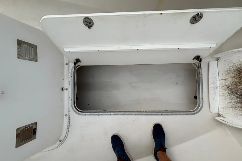 Slide: The Image of Open storage compartment on a 2006 Cape Horn 24 boat deck. - 24