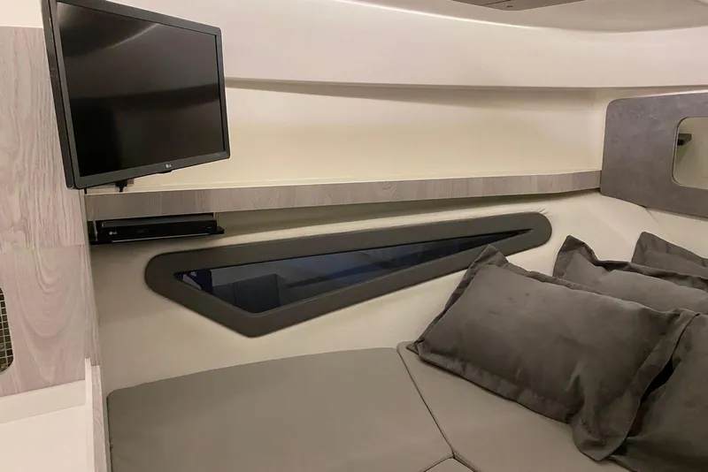 Slide: The Image of Interior of 2026 Hanover 375 yacht with TV and plush seating. - 11