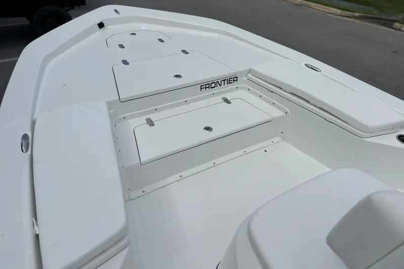 Slide: The Image of Frontier 2104 boat deck, 2027 model, featuring storage compartments and seating. - 13