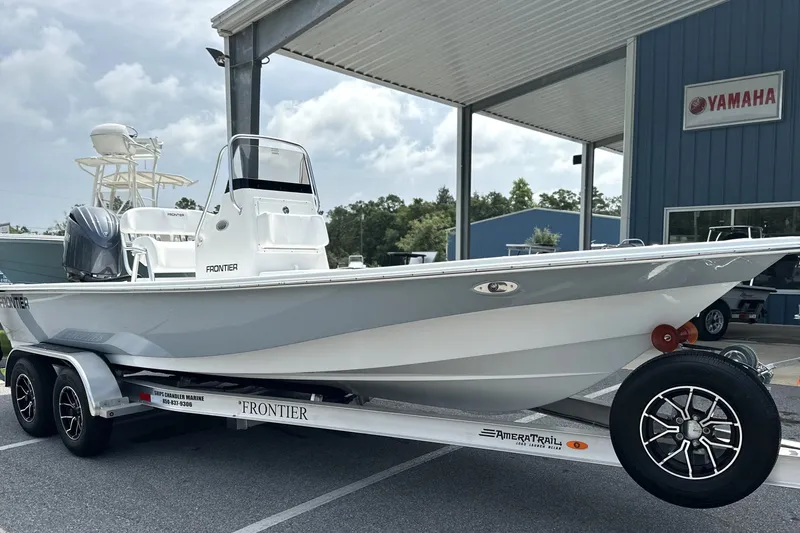 Slide: The Image of 2027 Frontier 2104 boat on trailer at Yamaha dealership, showcasing sleek design and modern features. - 29