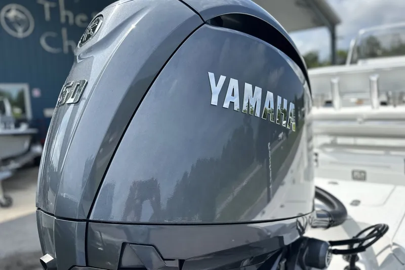 Slide: The Image of Yamaha outboard motor on a 2027 Frontier 2104 boat, close-up view. - 26