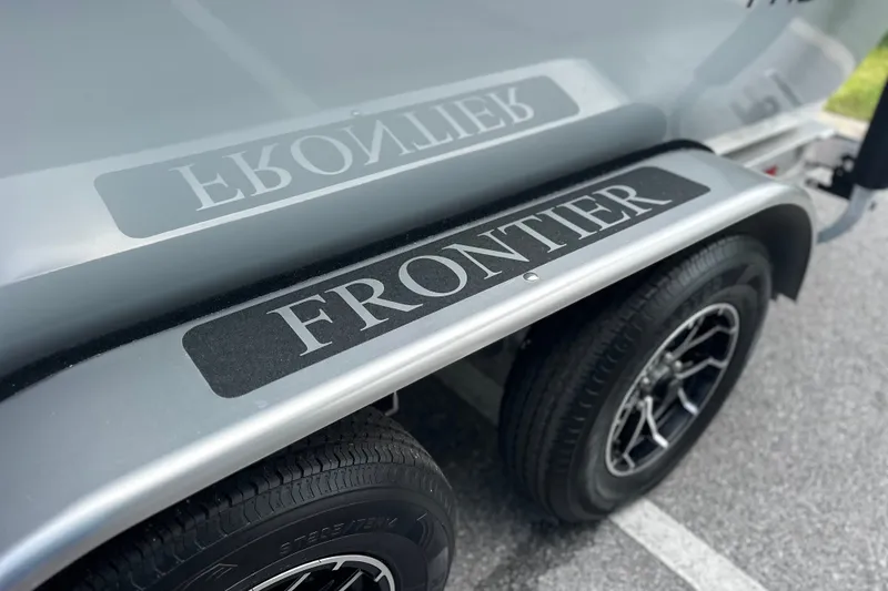 Slide: The Image of Close-up of 2027 Frontier 2104 trailer with logo on wheel fender. - 19
