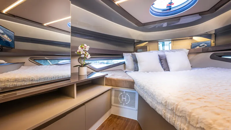 Slide: The Image of Luxurious cabin interior of 2025 Hanover 415 yacht with modern design and cozy bedding. - 5