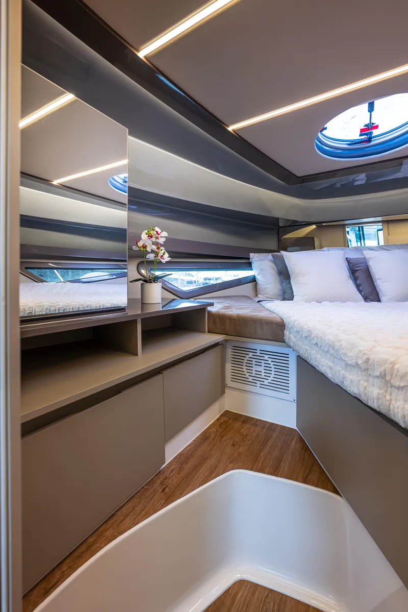 Slide: The Image of Luxurious interior of 2025 Hanover 415 yacht with modern design and cozy bedding. - 4