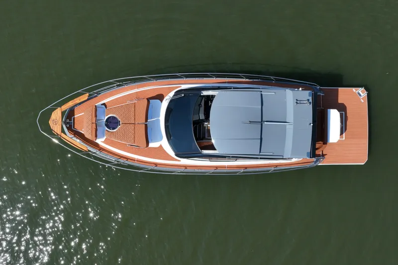 Slide: The Image of Aerial view of 2026 Hanover 415 luxury yacht on calm water. - 2