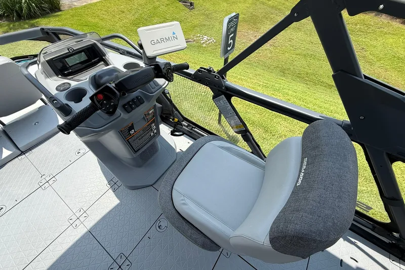 Slide: The Image of 2023 Sea-Doo Switch Sport 21 cockpit with Garmin navigation and comfortable seating. - 9
