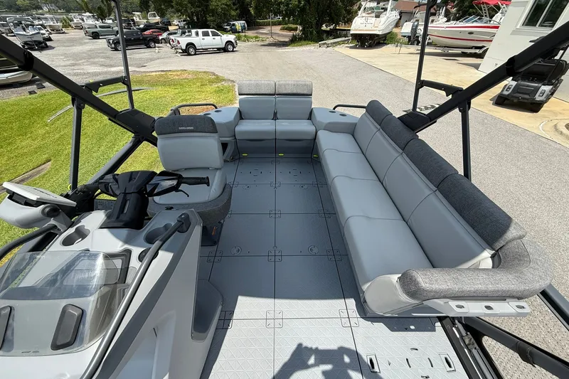 Slide: The Image of 2023 Sea-Doo Switch Sport 21 pontoon boat interior with spacious seating and modern design. - 10