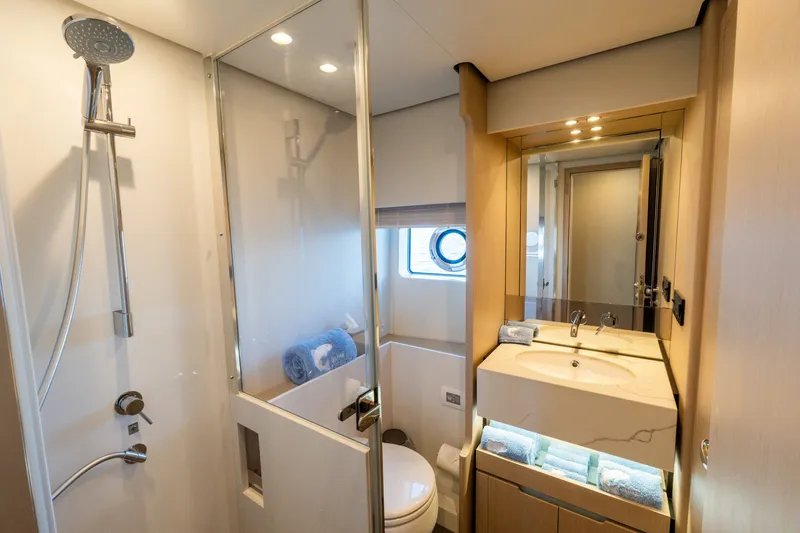 Slide: The Image of Luxurious bathroom in 2023 Azimut Fly 68 yacht, featuring modern shower and elegant vanity. - 41