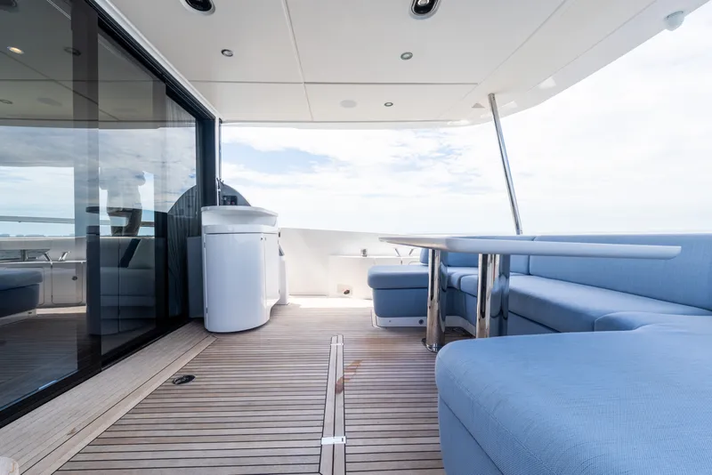 Slide: The Image of Luxurious 2023 Azimut Fly 68 yacht deck with modern seating and ocean view. - 12