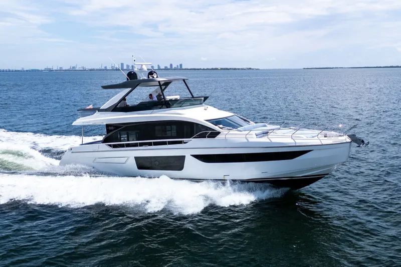 The Image of 2023 Azimut Fly 68 yacht cruising on open water, showcasing sleek design and luxury. - 0