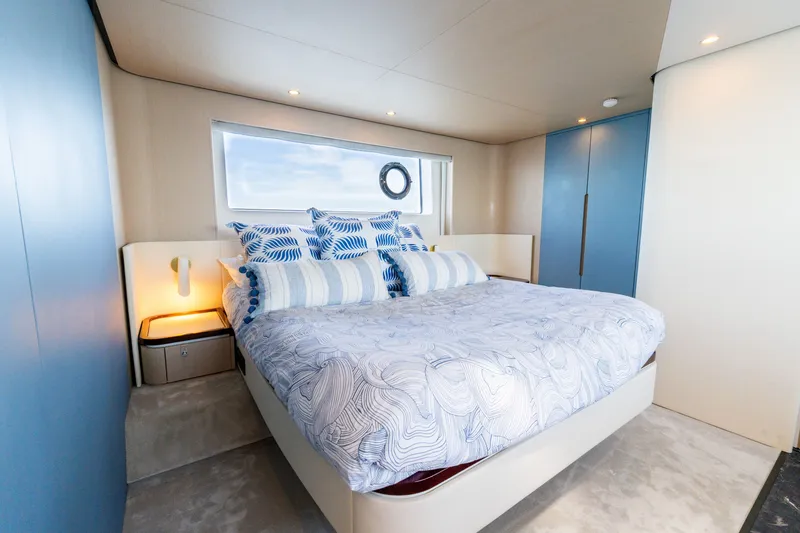 Slide: The Image of Luxurious bedroom interior of 2023 Azimut Fly 68 yacht with modern design and ocean view. - 29