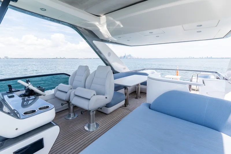 Slide: The Image of Luxurious 2023 Azimut Fly 68 yacht interior with plush seating and ocean view. - 26